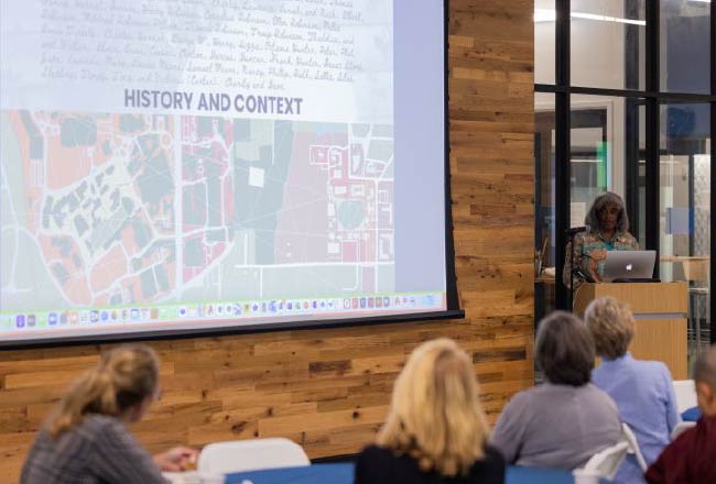 Members of a listening session watching a presentation